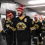 Boston Bruins rock Patriots toques in warm-up, lend Super Bowl support