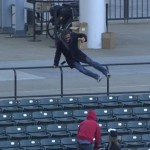 Fan chases down foul ball, drops phone and beer in the process